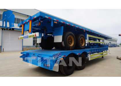 2 set 4 axles low bed semi trailers are packaging for shipment to Mauritania
